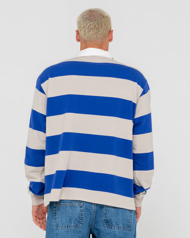 Man wearing Wilk Long Sleeve Rugby in Blue