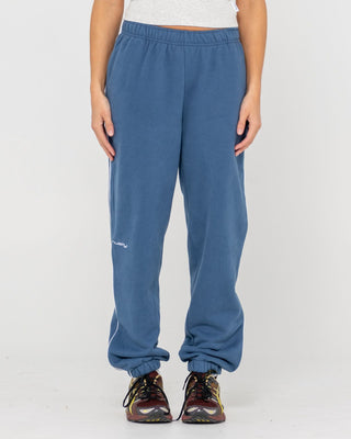 Woman wearing South Cuffed Low Rise Track Pant in Atlantic Blue