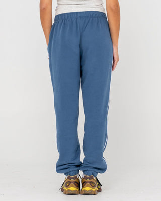 Woman wearing South Cuffed Low Rise Track Pant in Atlantic Blue