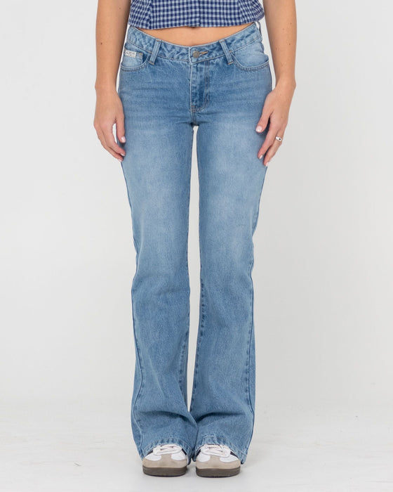woman-wearing-betty-bootleg-low-rise-jean-in-blasted-middy-blue