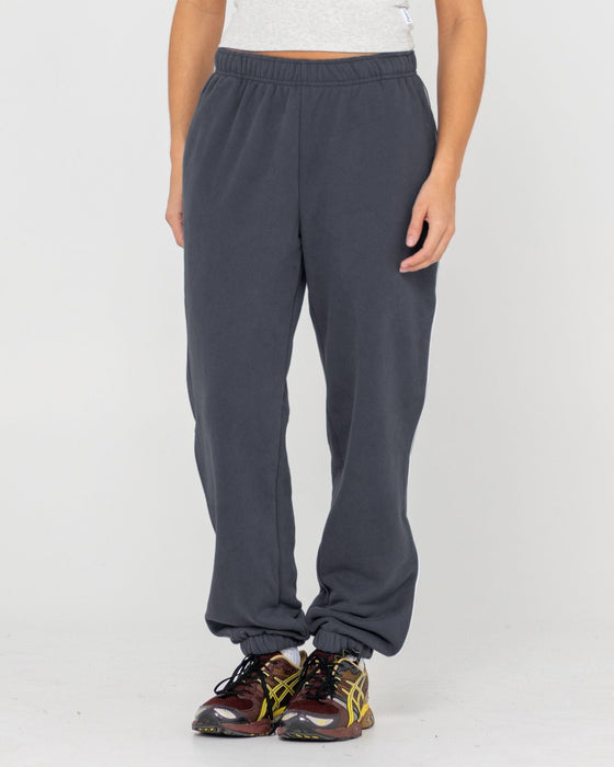 woman-wearing-rusty-essentials-low-rise-track-pant-in-carbon
