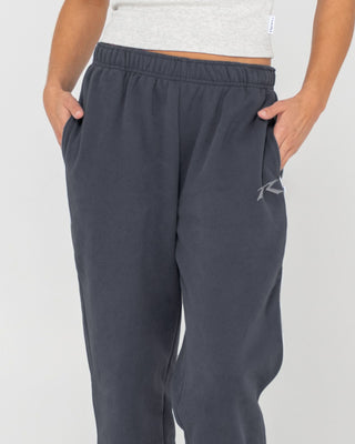 Woman wearing Rusty Essentials Low Rise Track Pant in Carbon