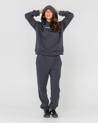 Woman wearing Rusty Essentials Low Rise Track Pant in Carbon