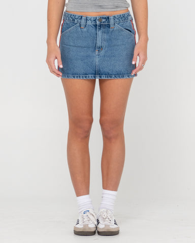 Woman wearing Flip Mommy Low Rise Mini Denim Skirt in Blue