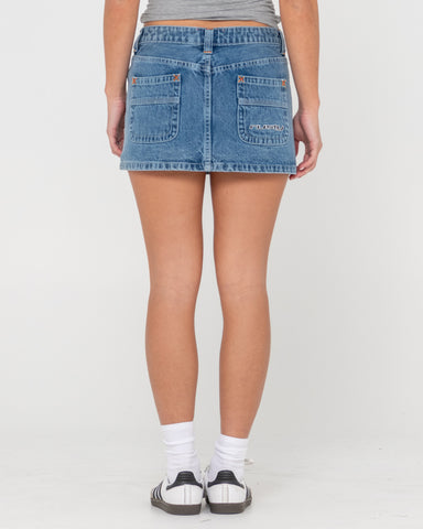 Woman wearing Flip Mommy Low Rise Mini Denim Skirt in Blue