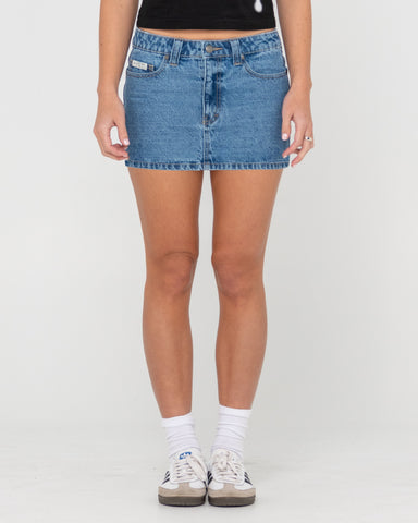 Woman wearing Mavericks Low Rise Denim Mini Skirt in Blue