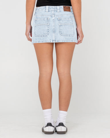 Woman wearing Mavericks Low Rise Denim Mini Skirt in Blue