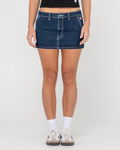 Woman wearing Billie Low Rise Denim Mini Skirt in Blue