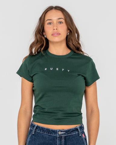 Woman wearing Rusty Core Skimmer Baby Tee in Green