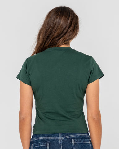 Woman wearing Rusty Core Skimmer Baby Tee in Green