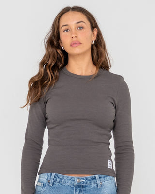 Woman wearing Rusty Essentials Ribbed Long Sleeve Tee in Carbon
