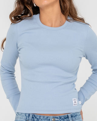 Woman wearing Rusty Essentials Ribbed Long Sleeve Tee in Glacier Lake
