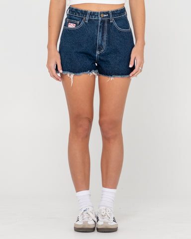 Woman wearing Penny Kick Flare Denim Short in Blue