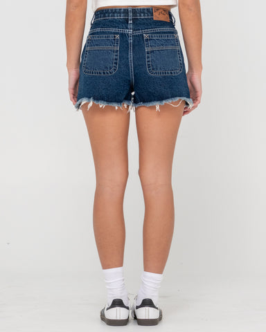 Woman wearing Penny Kick Flare Denim Short in Blue