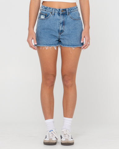 Woman wearing Penny Kick Flare Denim Short in Blue