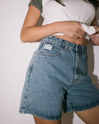 Woman wearing Cyprus High Denim Short in Blue