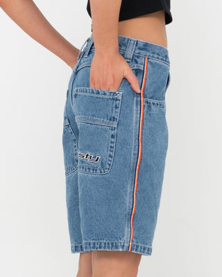 Woman wearing Flip Mommy Low Rise Wide Leg Denim Jort in Middy Blue / Orange