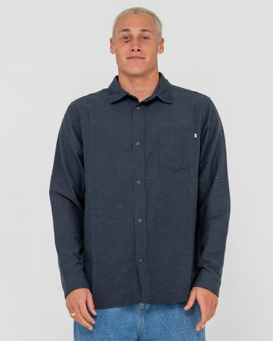 Man wearing Overtone Long Sleeve Linen Shirt in Blue