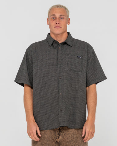 Man wearing Resno Check Short Sleeve Shirt in Black