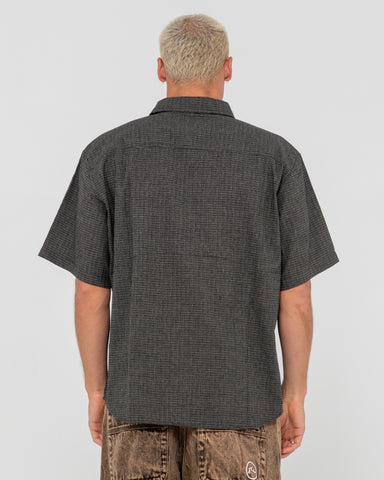 Man wearing Resno Check Short Sleeve Shirt in Black