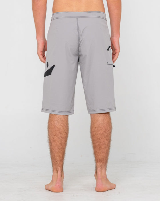 man-wearing-fixed-competition-revolution-boardshort-in-stone-grey
