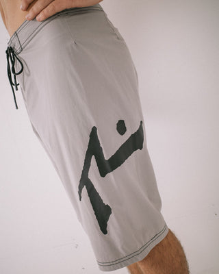 Man wearing Fixed Competition Revolution Boardshort in Stone Grey