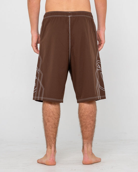 man-wearing-tombstones-hybrid-waist-boardshort-in-pinecone