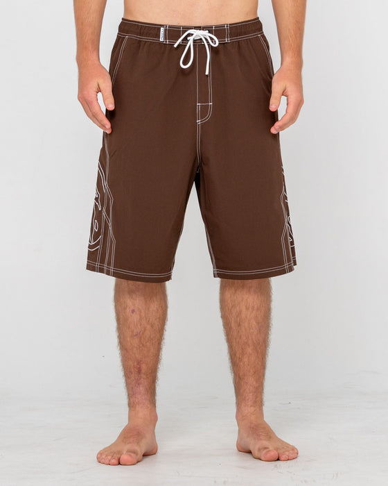 man-wearing-tombstones-hybrid-waist-boardshort-in-pinecone