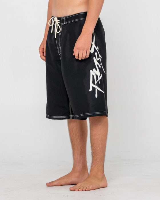 man-wearing-hoodus-fixed-waist-boardshort-in-black-2