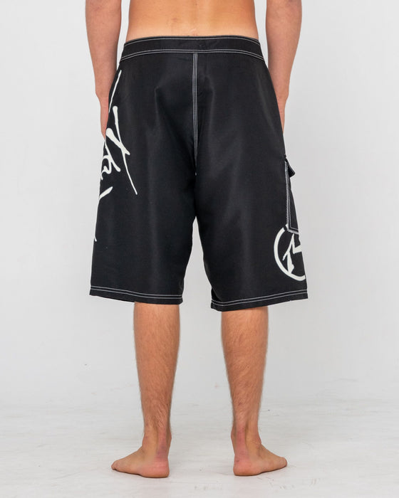 man-wearing-hoodus-fixed-waist-boardshort-in-black-2