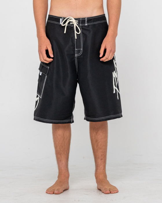 man-wearing-hoodus-fixed-waist-boardshort-in-black-2