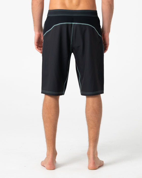 man-wearing-hydro-surge-fixed-waist-boardshort-in-black