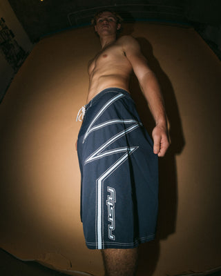 Man wearing Slasher Fixed Waist Boardshort in Navy Blue