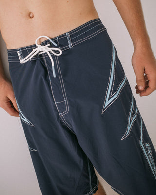 Man wearing Slasher Fixed Waist Boardshort in Navy Blue