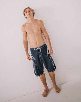 Man wearing Slasher Fixed Waist Boardshort in Navy Blue