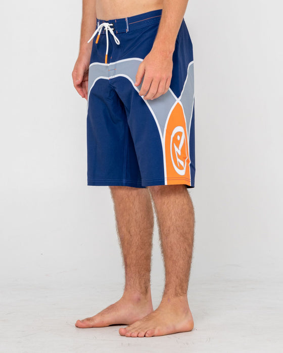 man-wearing-griffin-fixed-waist-boardshort-in-dark-blue