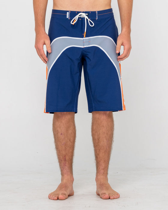 man-wearing-griffin-fixed-waist-boardshort-in-dark-blue