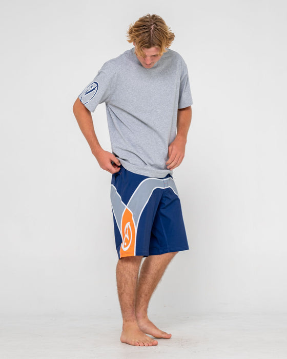man-wearing-griffin-fixed-waist-boardshort-in-dark-blue