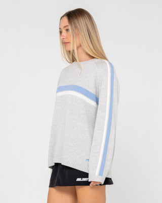 Woman wearing White Lines Long Sleeve Crew Neck Knit in Grey Marle / Blue