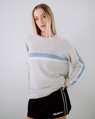 Woman wearing White Lines Long Sleeve Crew Neck Knit in Grey Marle / Blue
