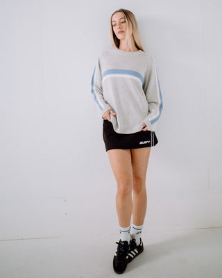 Woman wearing White Lines Long Sleeve Crew Neck Knit in Grey Marle / Blue