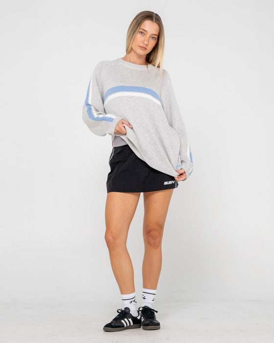 woman-wearing-white-lines-long-sleeve-crew-neck-knit-in-grey-marle-blue