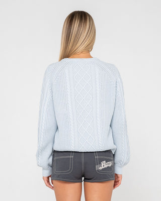 Woman wearing Two Tales Knitted Crew in Retro Blue
