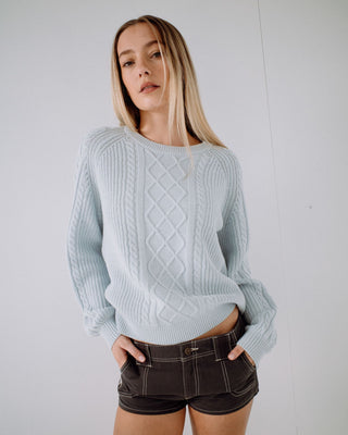 Woman wearing Two Tales Knitted Crew in Retro Blue