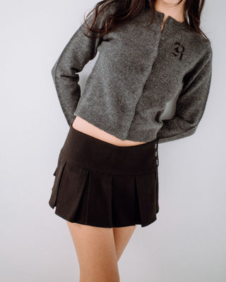 Woman wearing Rusty Academy Cardigan in Charcoal Marle
