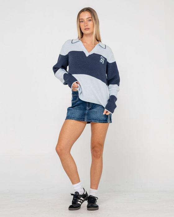 woman-wearing-try-me-knitted-rugby-top-in-retro-blue-navy