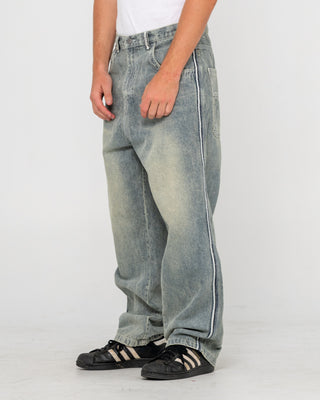 Man wearing Flip Daddy 2.0 Jean in Dirty Dawg / Grey