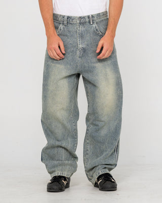 Man wearing Flip Daddy 2.0 Jean in Dirty Dawg / Grey