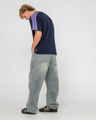 Man wearing Flip Daddy 2.0 Jean in Dirty Dawg / Grey