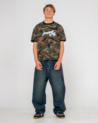 Man wearing Flip Daddy 2.0 Jean in Dark N Dirty / Orange